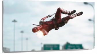 Lienzo Dead Pool saltando y disparando